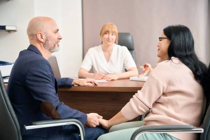 Husband and wife visiting reproductologist at private medical clinic to make health check-up before planning baby, responsibility and reliability